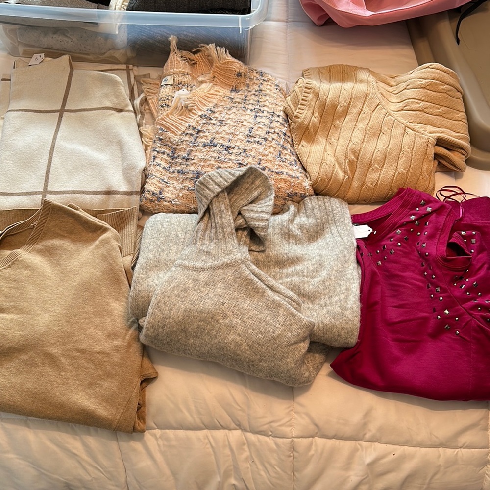 Six. Women’s assorted, sweaters size large\XL.